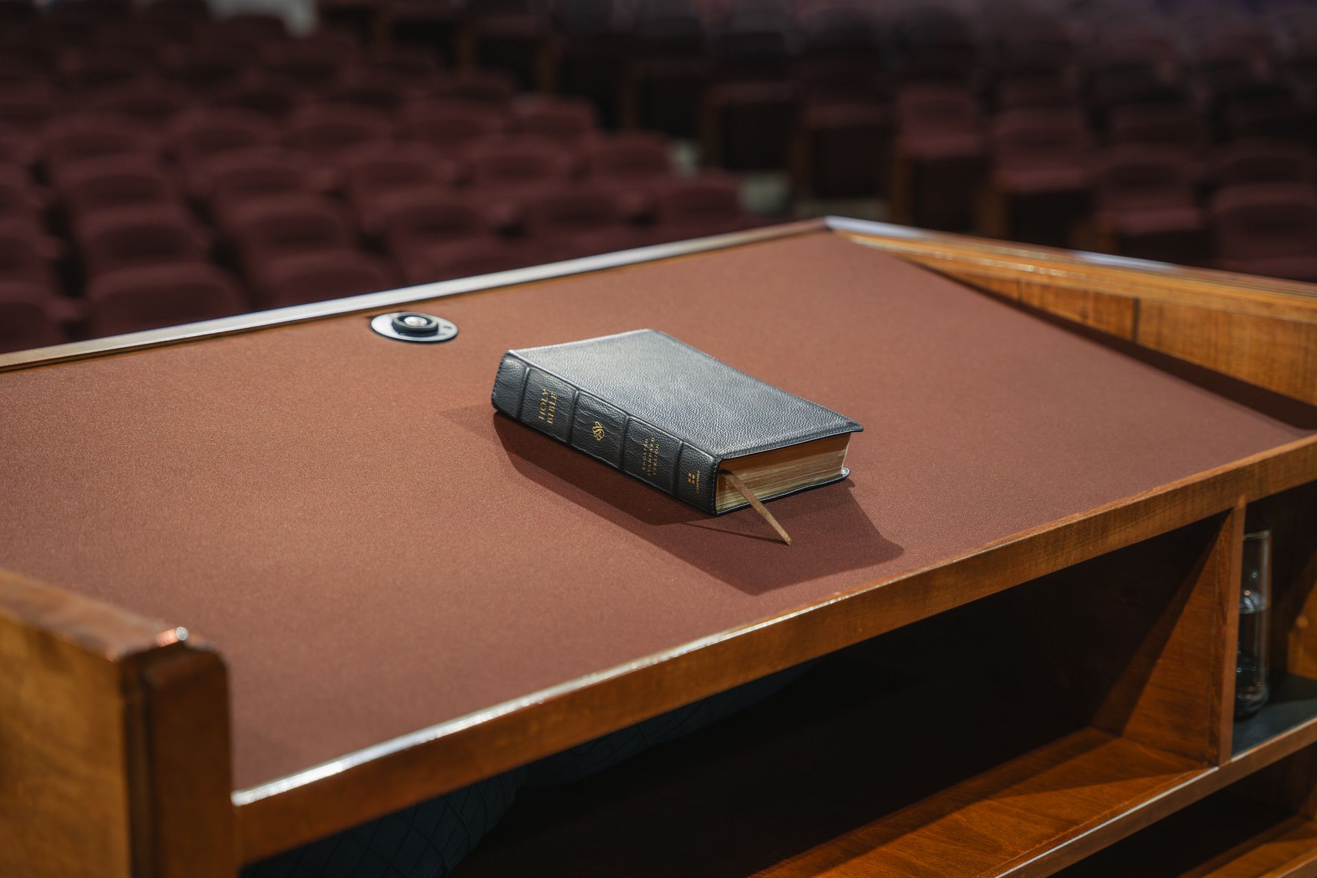 A Bible resting on the pulpit in the Trinity Bible Chapel sanctuary