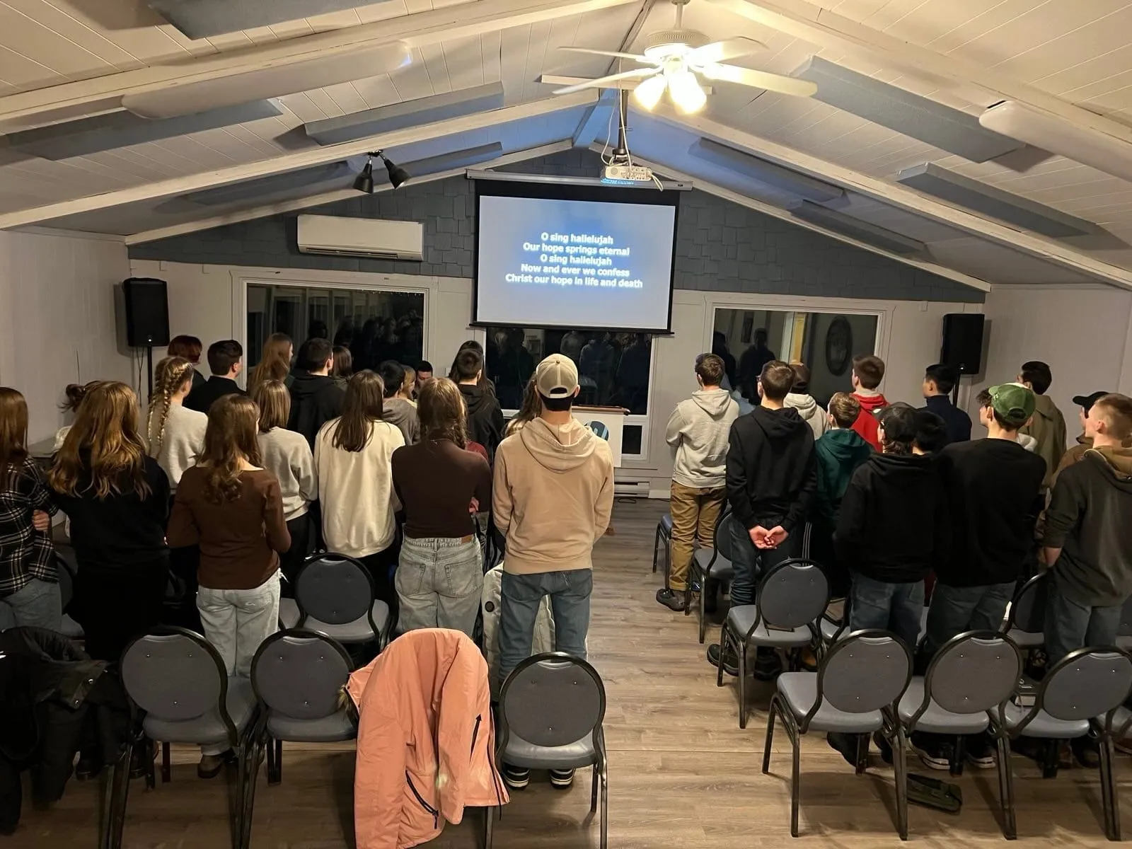 Students worshipping together at the Trinity Youth retreat